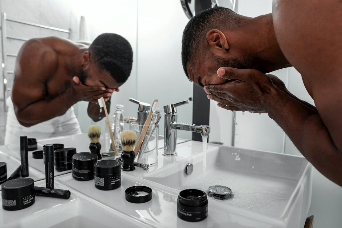 Man at a bathroom sink during his daily skincare and grooming routine